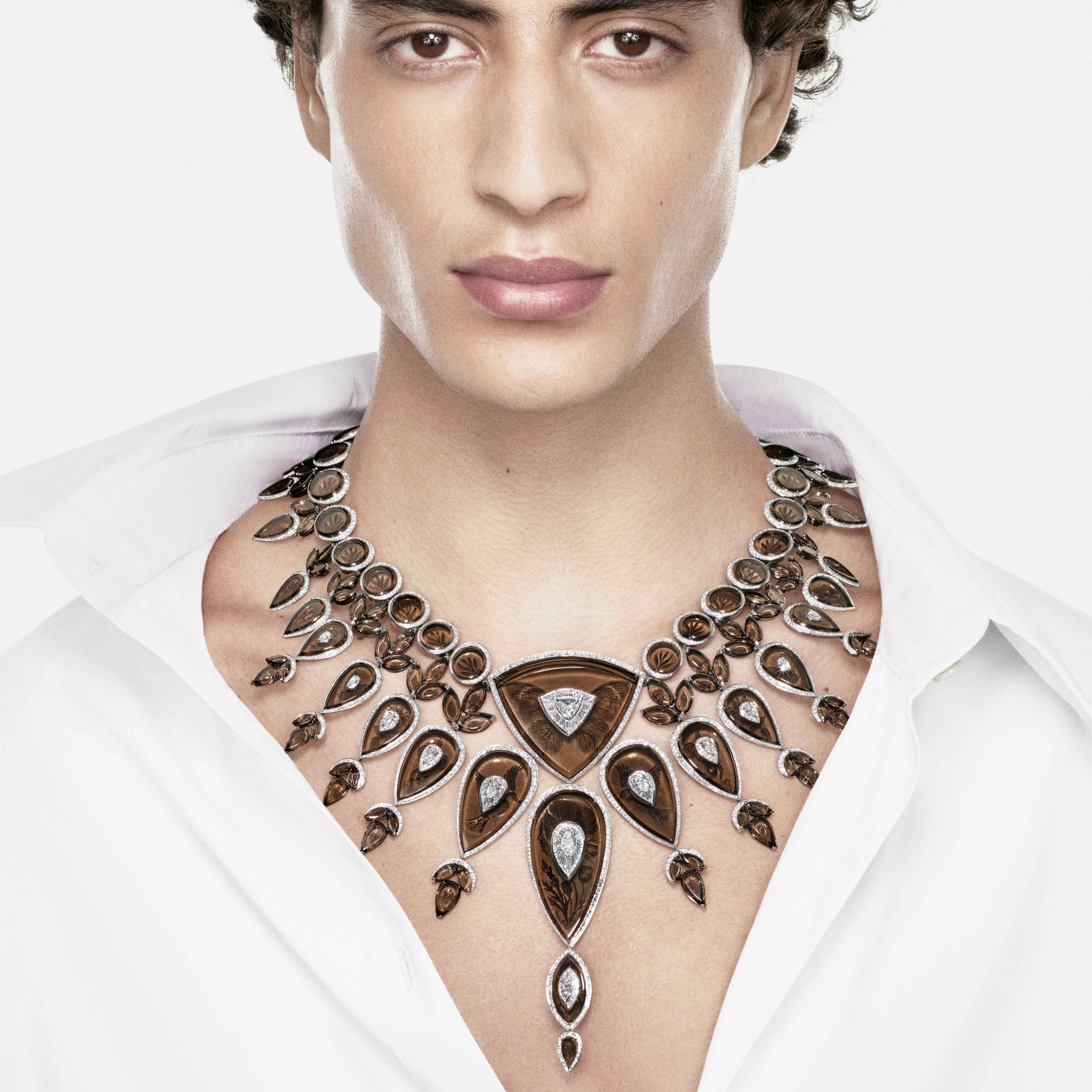 A model wears Boucheron’s Tattoo necklace of smoky quartz, diamonds and white gold over a white shirt